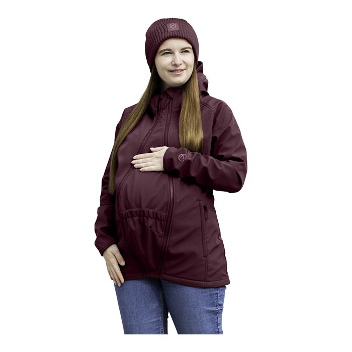 Pregnant woman in a burgundy mamalila softshell babywearing jacket with room for her baby bump