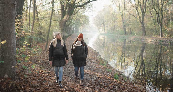 Pregnant women and mother with child take a walk